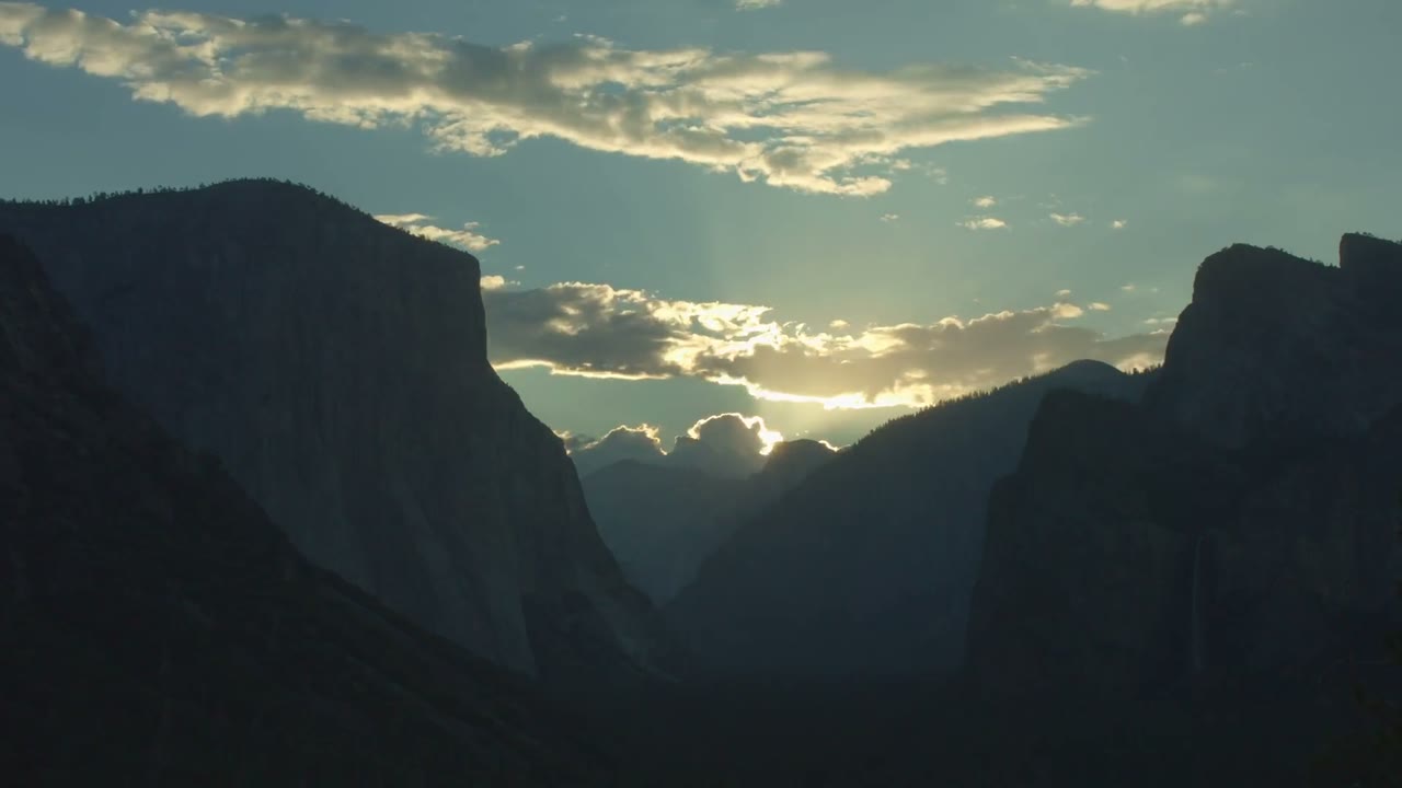 Granite cliffs and a valley at dusk, from the air