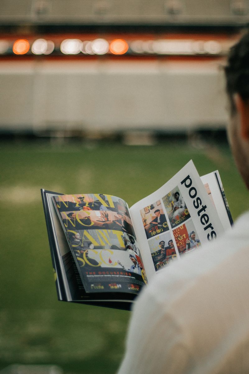 The open book held out over the stadium field